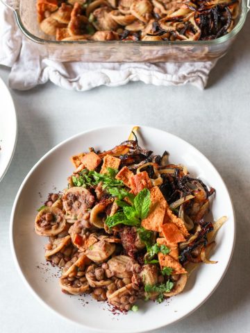 This horaa osbao (horak esbao) is a syrian pasta dish with lentils and tangy pomegranate sauce.