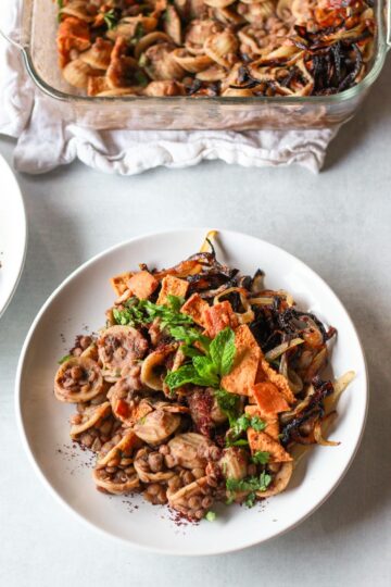 This horaa osbao (horak esbao) is a syrian pasta dish with lentils and tangy pomegranate sauce.