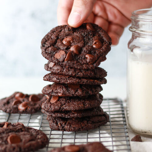 The best gluten-free, oil-free, and vegan double chocolate chip cookies that can be enjoyed in just 15 minutes and require just 7 ingredients! A one bowl vegan dessert recipe.