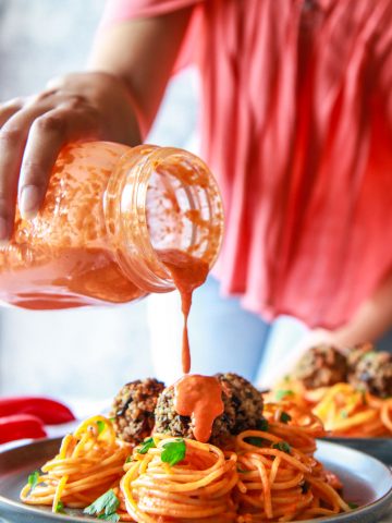 These eggplant meatballs are complemented with a roasted red pepper tahini sauce, served over pasta. Made with eggplants, walnuts, and parsley, these vegan meatballs are gluten-free with an oil-free option.