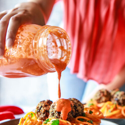 These eggplant meatballs are complemented with a roasted red pepper tahini sauce, served over pasta. Made with eggplants, walnuts, and parsley, these vegan meatballs are gluten-free with an oil-free option.