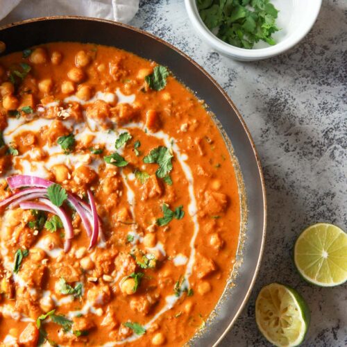 This vegan butternut squash & chickpea panang curry is a sweet, peanut flavored curry, inspired by the classic Thai dish. This vegan Thai peanut curry uses vegan panang curry paste, peanut butter, and coconut milk to create a rich and creamy base. This plant based curry uses chickpea and butternut squash instead of meat. Gluten-free with a n oil-free option.