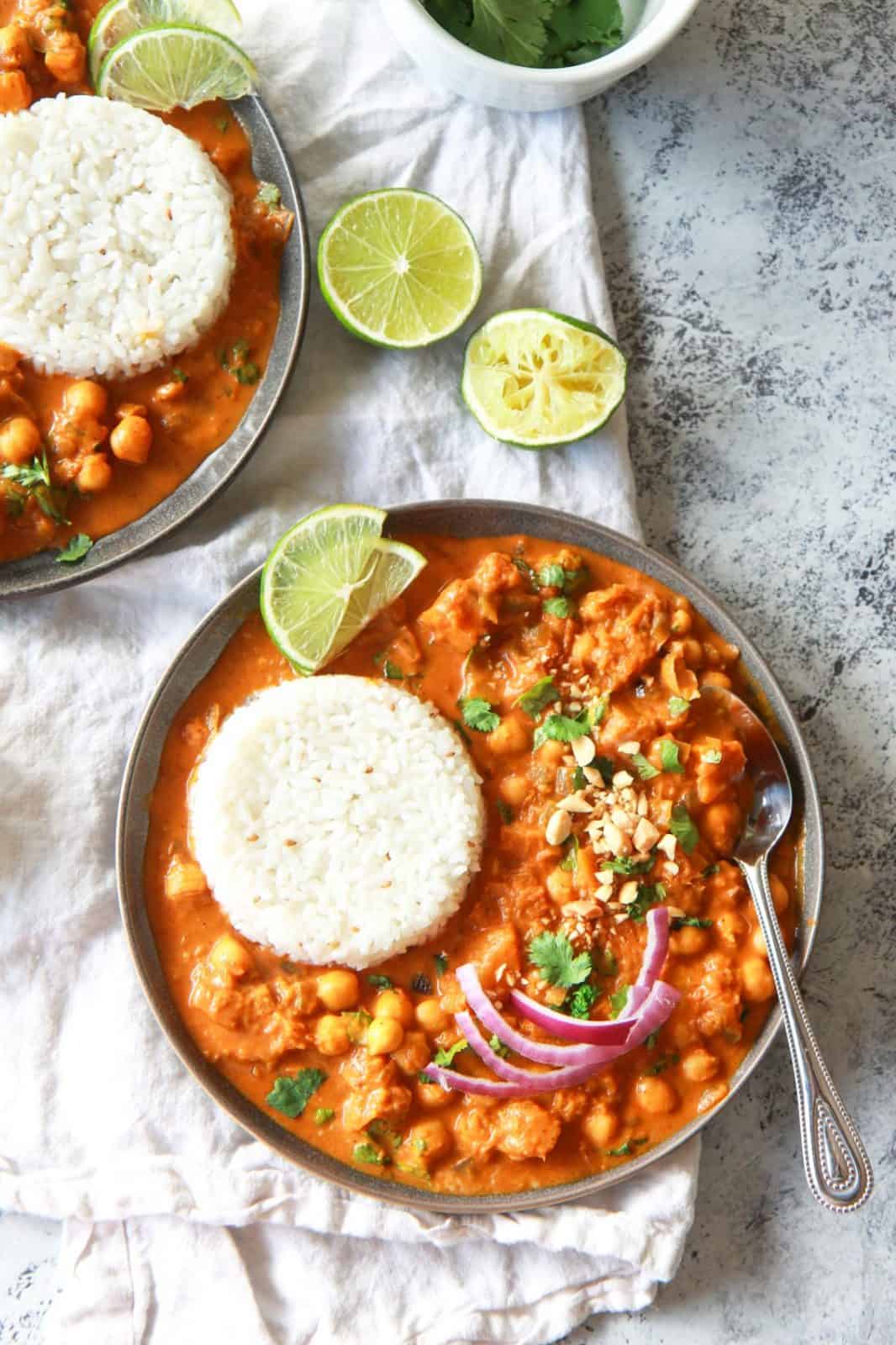 This vegan butternut squash & chickpea panang curry is a sweet, peanut flavored curry, inspired by the classic Thai dish. This vegan Thai peanut curry uses vegan panang curry paste, peanut butter, and coconut milk to create a rich and creamy base. This plant based curry uses chickpea and butternut squash instead of meat. Gluten-free with an oil-free option.