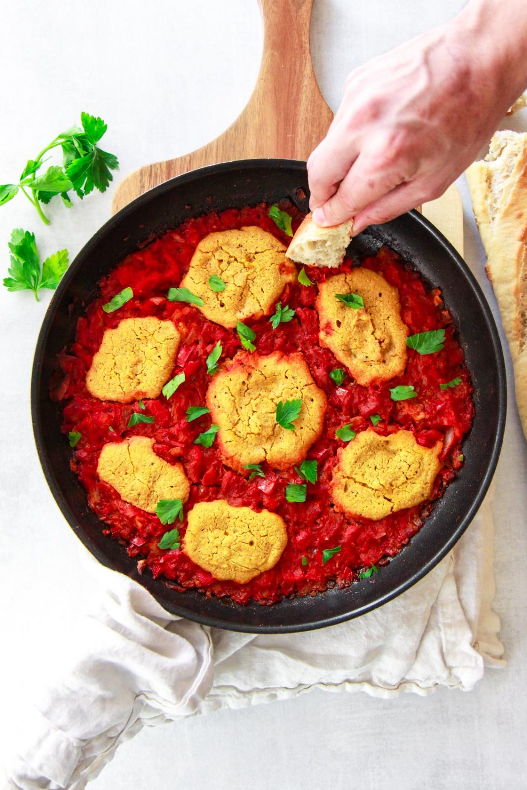 This vegan shakshuka make a delicious Middle Eastern breakfast. This Mediterranean brunch recipe is made plant based using chickpea based eggs baked in a tomato and red pepper sauce.