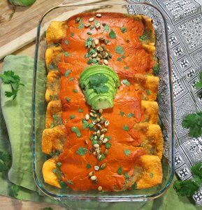 The best sweet potato and black bean enchiladas covered in tangy salsa verde and a gooey, vegan chipotle cashew cheese.