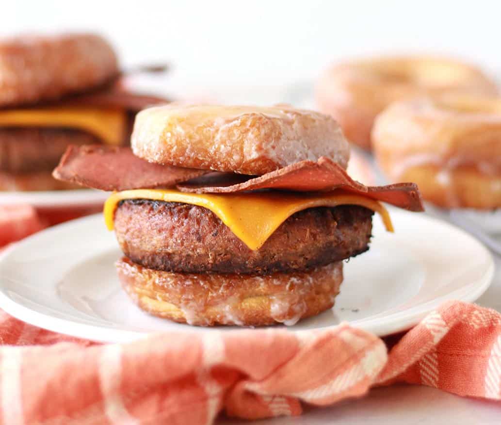 This vegan bacon cheeseburger is sandwiched between two glazed donuts as buns! Also known as the Luther Burger, this innovative veggie burger recipe comes with an easy vegan donut hack.