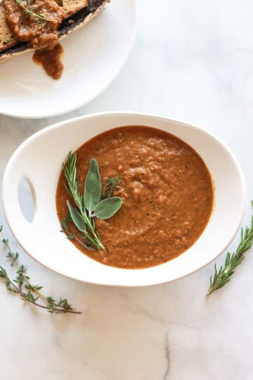 This herb and caramelized onion gravy is a flavor rich, gluten-free, vegan holiday recipe.