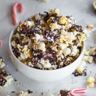 This vegan and gluten-free peppermint bark popcorn is the perfect holiday treat. Covered in crushed candy canes and dark chocolate, this Christmas recipe had a satisfying combination of sweet and savory notes.