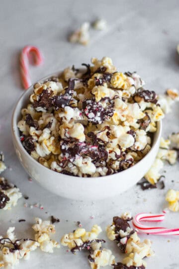 This vegan and gluten-free peppermint bark popcorn is the perfect holiday treat. Covered in crushed candy canes and dark chocolate, this Christmas recipe had a satisfying combination of sweet and savory notes.