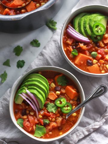 This warming lentil and sweet potato chili is the perfect comfort food for colder months. Packed full of flavor, this vegan sweet potato chili recipe is also gluten-free.