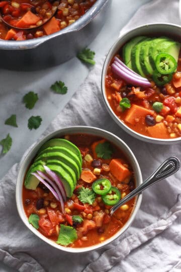 This warming lentil and sweet potato chili is the perfect comfort food for colder months. Packed full of flavor, this vegan sweet potato chili recipe is also gluten-free.