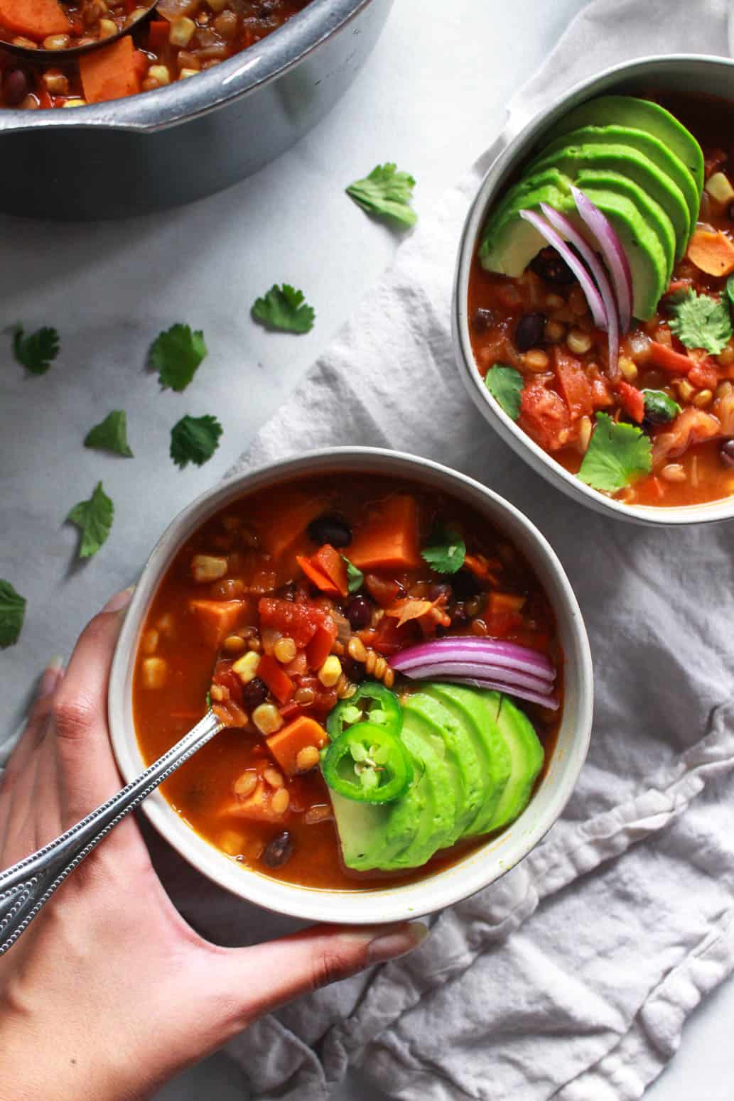 This warming lentil and sweet potato chili is the perfect comfort food for colder months. Packed full of flavor, this vegan sweet potato chili recipe is also gluten-free.