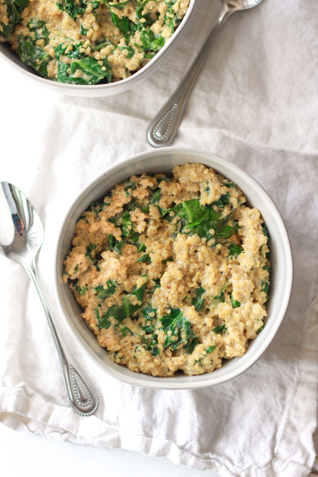 These creamy coconut quinoa and greens make a deliciosu vegan Thanksgiving side dish.