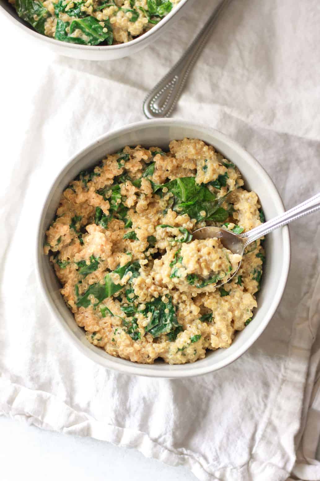 This savory, creamy quinoa and greens is a versatile side dish, but also filling enough to be a main. Coconut milk adds creaminess to this flavorful savory quinoa dish. This creamy coconut quinoa and greens is packed with umami flavor and protein!