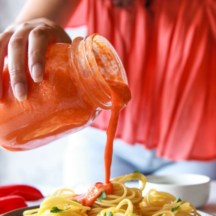This roasted red pepper tahini sauce is a vegan recipe that is super creamy, oil-free, and perfect over pasta. It is made of sesame paste and roasted red bell peppers.