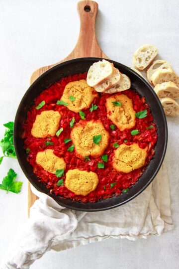 This vegan shakshuka make a delicious Middle Eastern breakfast. This Mediterranean brunch recipe is made plant based using chickpea based eggs baked in a tomato and red pepper sauce.