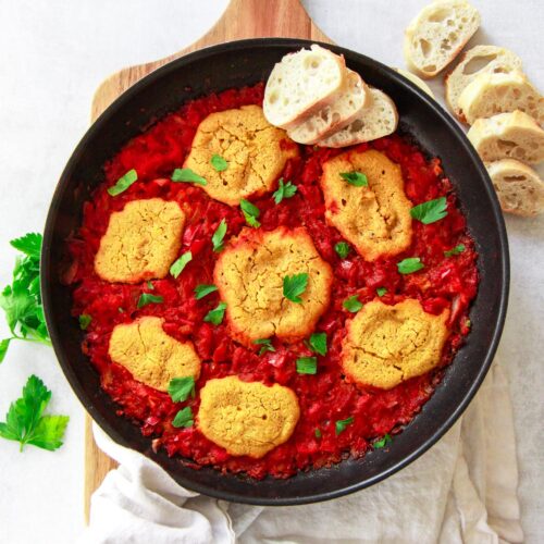 This vegan shakshuka make a delicious Middle Eastern breakfast. This Mediterranean brunch recipe is made plant based using chickpea based eggs baked in a tomato and red pepper sauce.