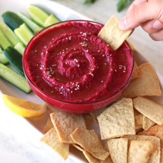 This roasted garlic beet dip makes a delicious vegan thanksgiving appetizer.