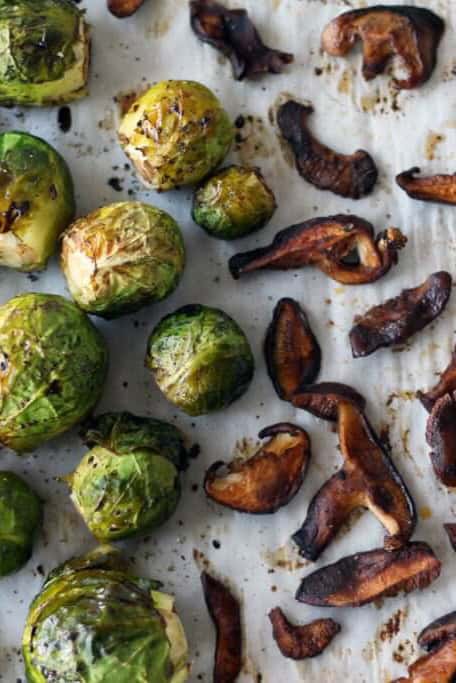 These vegan brussels sprouts with shiitake bacon and maple dijon dip make a delicious holiday side dish.