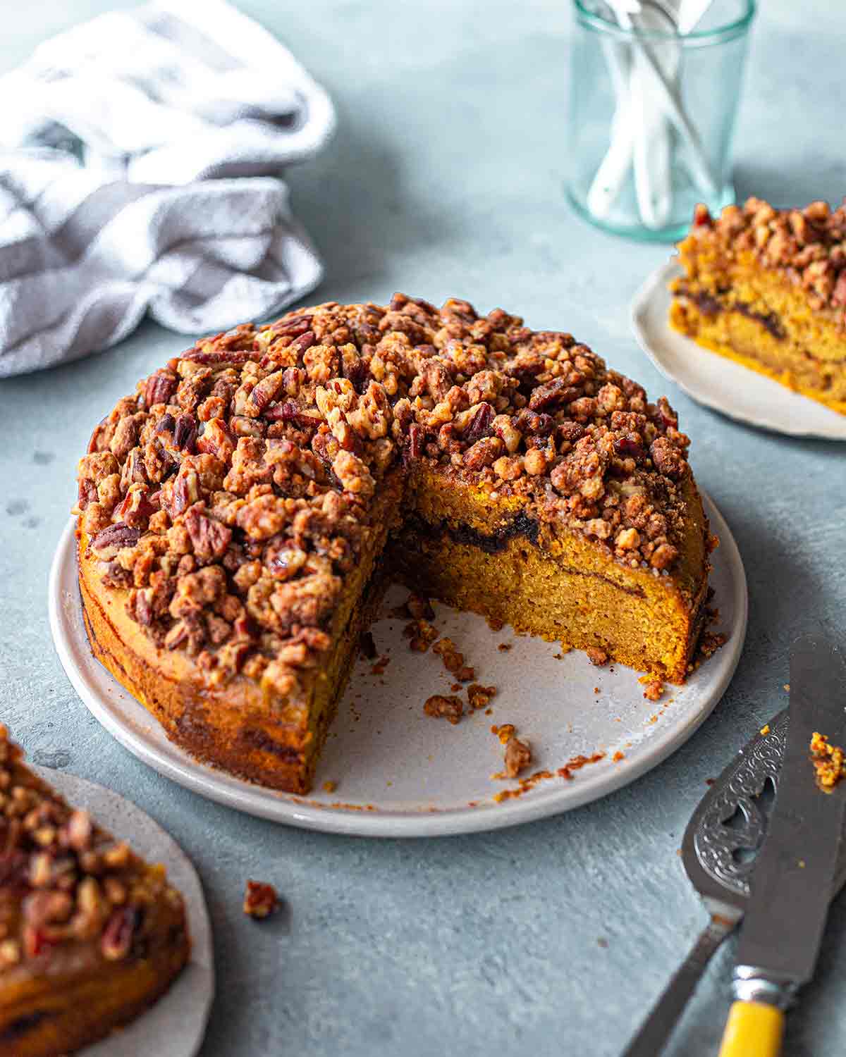 This vegan pumpkin coffee cake is a delicious Thanksgiving dessert.