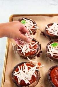 These vegan portobello pizzas are a healthy, dairy free way to enjoy the flavors of pizza. Also gluten-free, you can customize each portobello pizza in this recipe to your liking with vegan cheese and veggie toppings.
