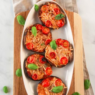 These vegan portobello pizzas are a healthy, dairy free way to enjoy the flavors of pizza. Also gluten-free, you can customize each portobello pizza in this recipe to your liking with vegan cheese and veggie toppings.