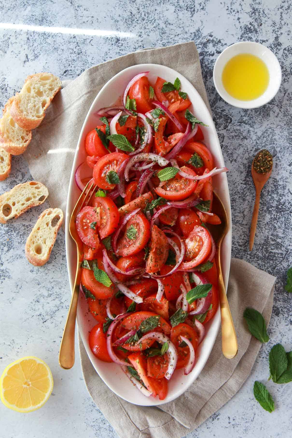 final assembly of tomato salad with zaatar