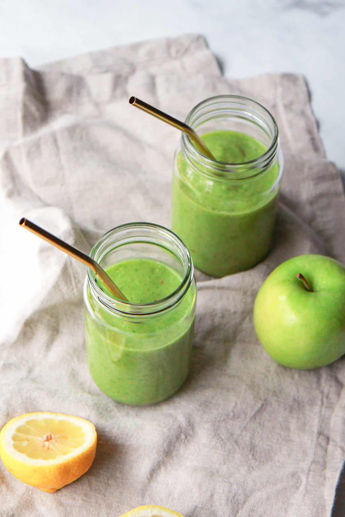 A top down view showing the texture of the kale apple smoothie with apple and lemon