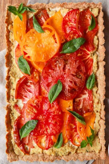 Vegan tomato tart with basil cashew ricotta and a gluten free tart crust