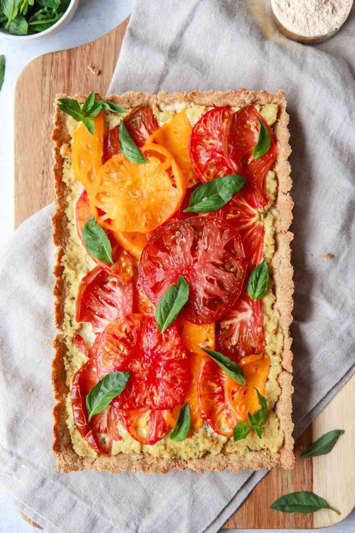 This image shows the baked vegan tomato basil tart before slicing