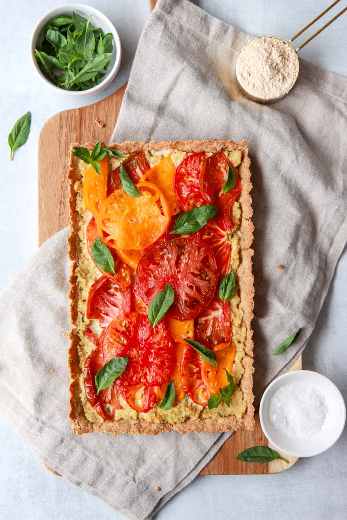 This shows the ingredients needed to make the vegan tomato basil tart