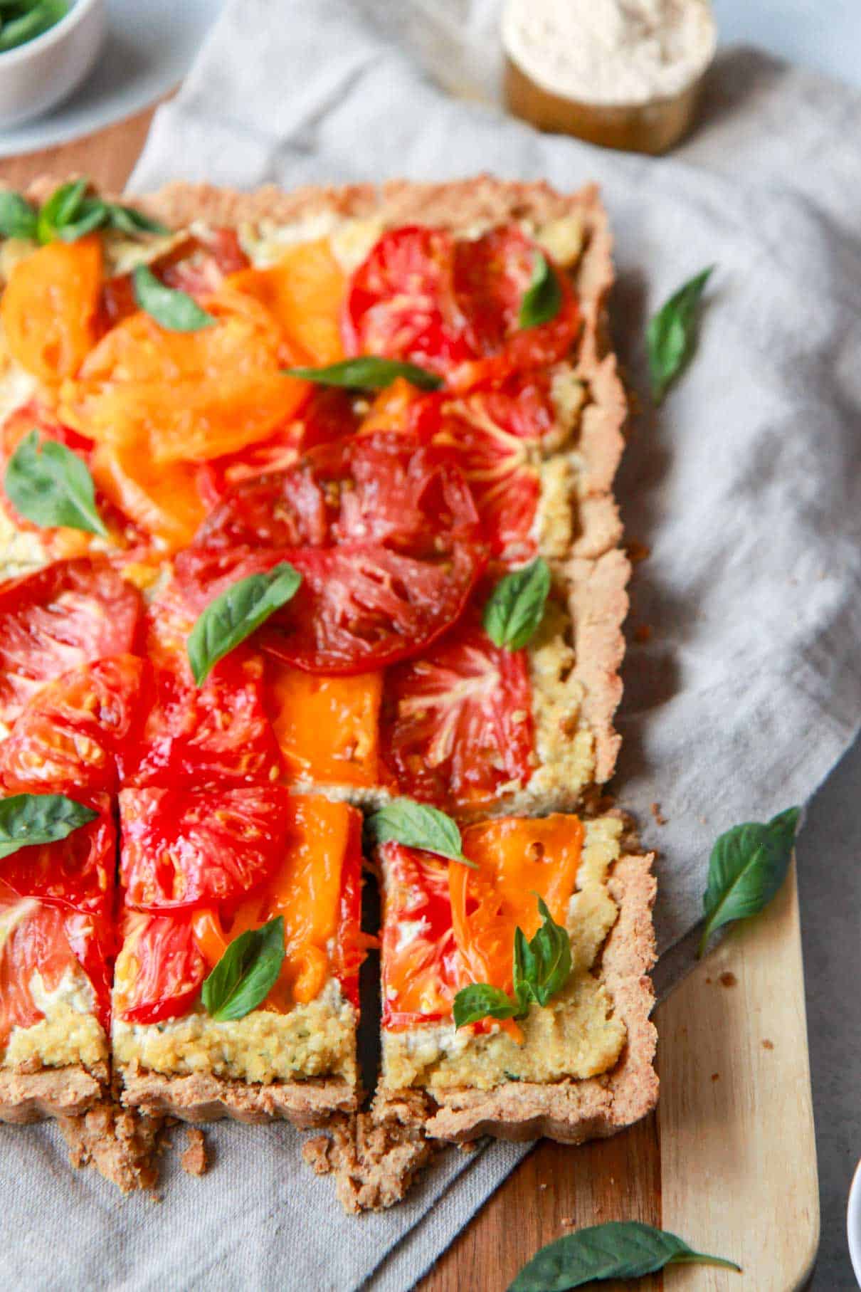 A close-up heirloom tomato tart slice