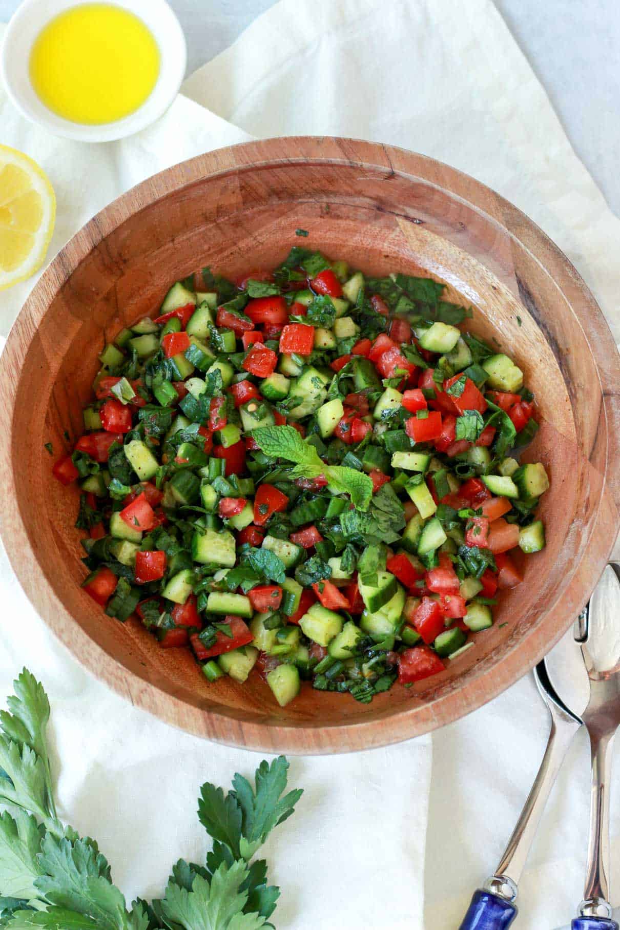 The salata is being garnished with mint leaves in this photo.