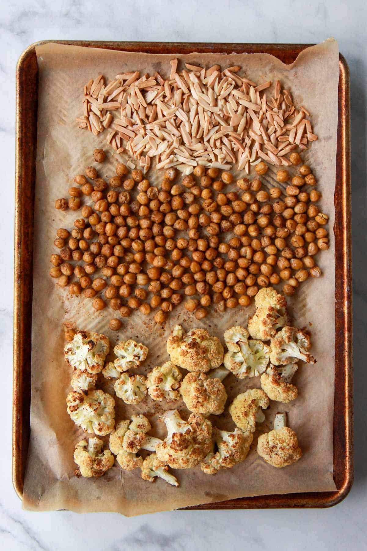 The cauliflower, chickpeas, and silvered almonds are roasted and browned to perfection.