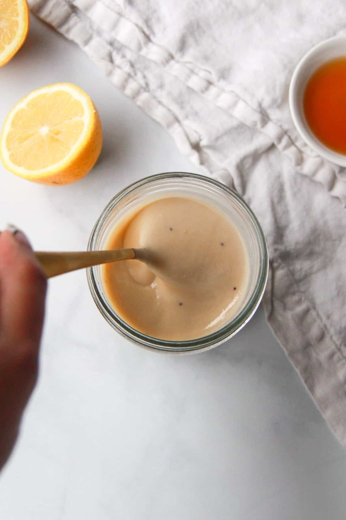 Showing the texture of the maple tahini dressing from an overhead view.