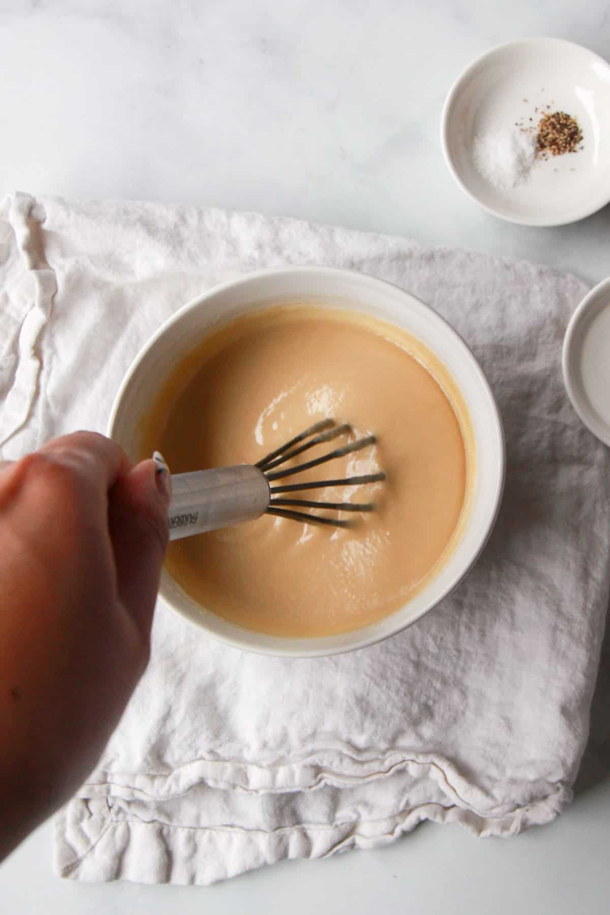 The maple syrup, tahini, and lemon juice whisked together until smooth.