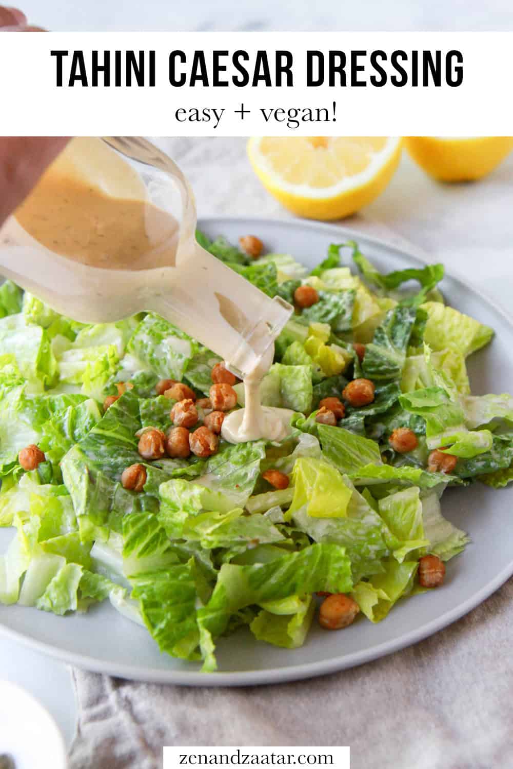 The tahini caesar being poured over salad with text overlay, "tahini caesar dressing: easy + vegan!".