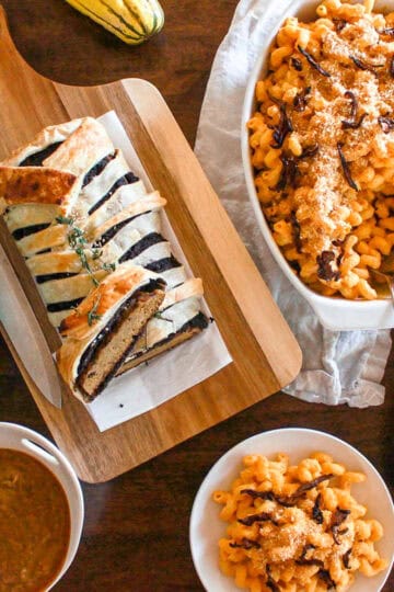 A vegan Thanksgiving table spread including plant-based mains, sides, and more.