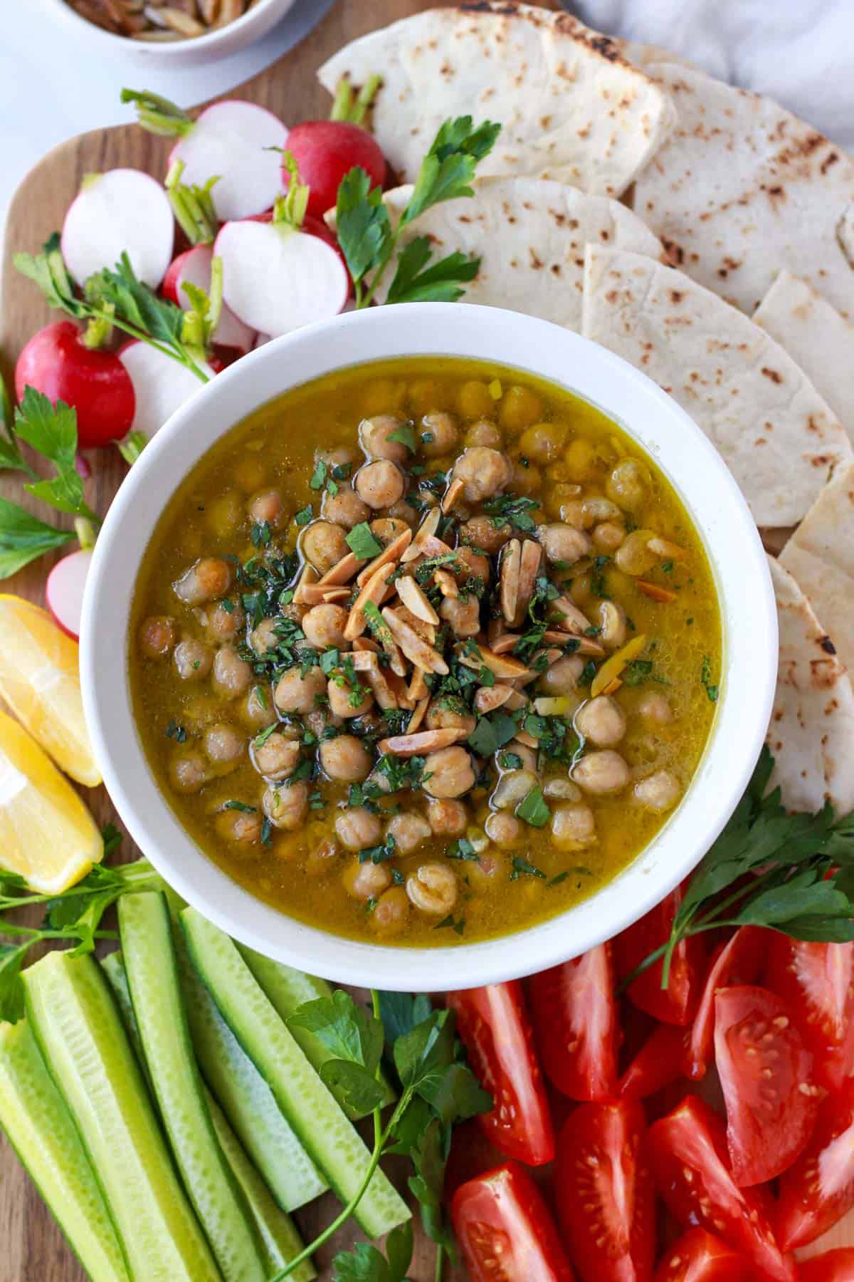 Balila on a platter surrounded by fresh crudités.