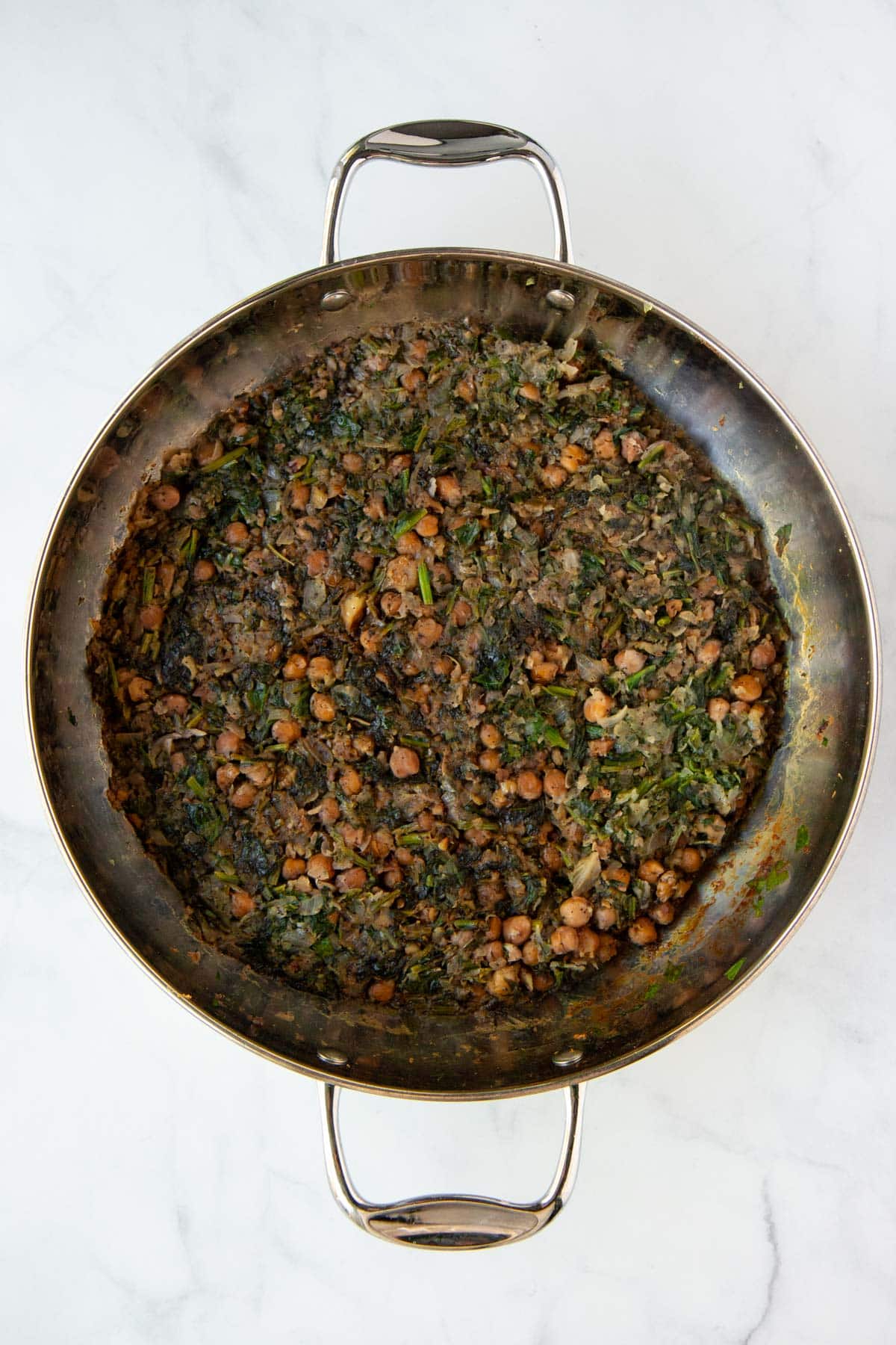 Cooked spinach, chickpea, walnut, and pomegranate filling for pumpkin kibbeh.